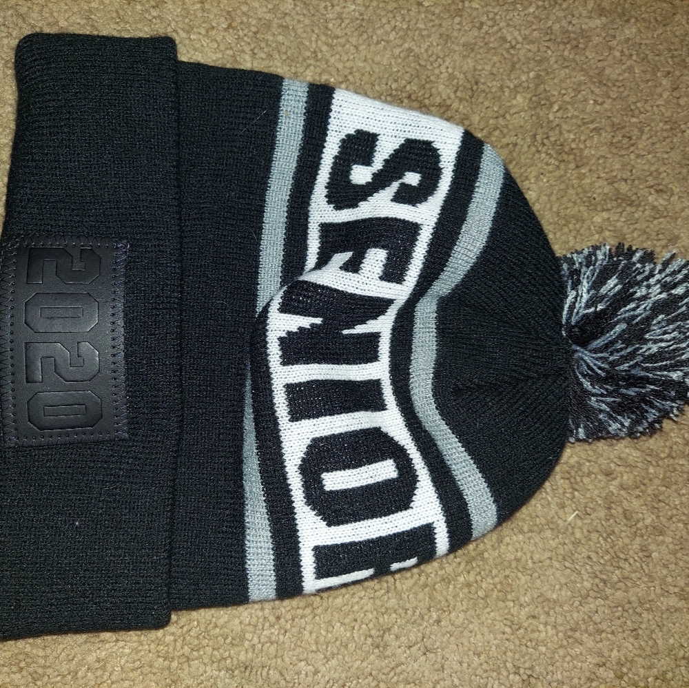 Puff ball winter hat by Jostens